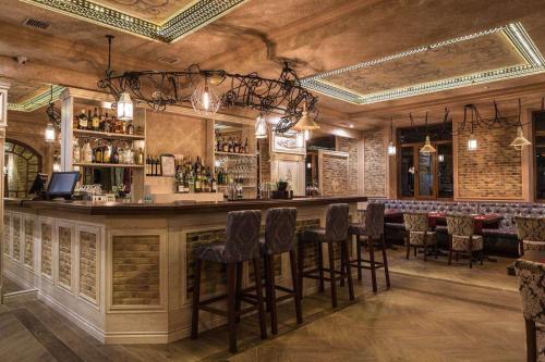 a bar in a restaurant with bar stools at Hotel Shengen "Шенген" in Kropyvnytskyi
