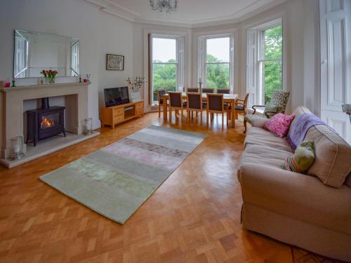 a living room with a couch and a fireplace at Escowbeck House in Lancaster