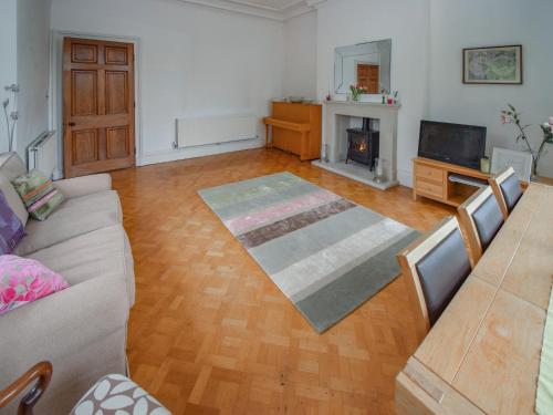 a living room with a couch and a fireplace at Escowbeck House in Lancaster