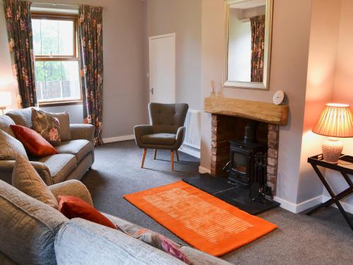 Χώρος καθιστικού στο Perch Hall Cottage