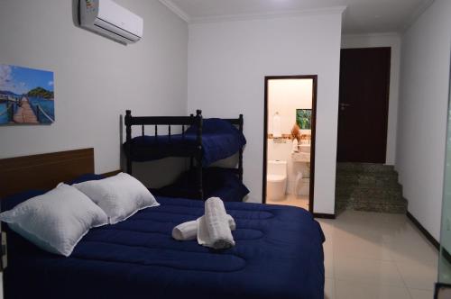 Ένα ή περισσότερα κρεβάτια σε δωμάτιο στο Tony Pousada Hotel Geribá