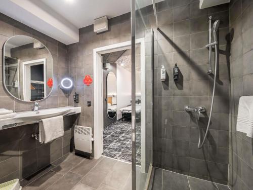 a bathroom with a shower and a sink at ibis Warszawa Centrum in Warsaw