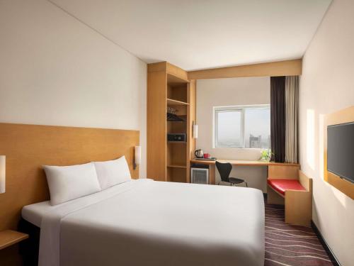 Postel nebo postele na pokoji v ubytování ibis Seef Manama