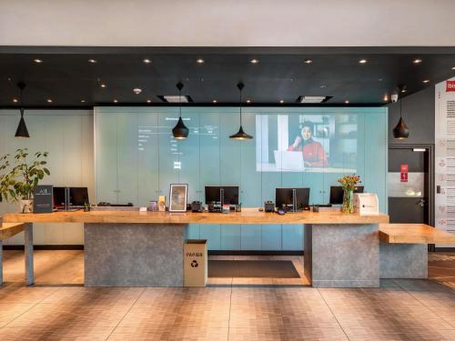 a large desk with a presentation in a room at ibis Warszawa Centrum in Warsaw
