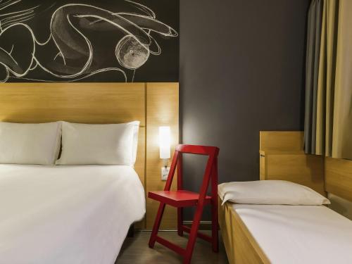 Postel nebo postele na pokoji v ubytování ibis Uberaba