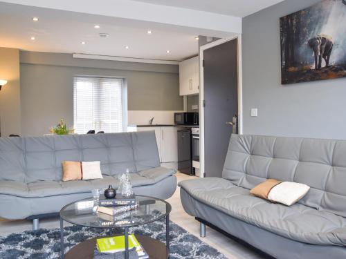 a living room with a couch and a table at Apartment 3 - Uk50137 in Stoke on Trent