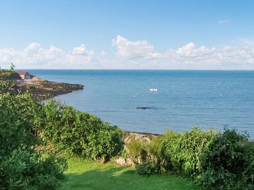a view of a large body of water at Gosteg in Moelfre