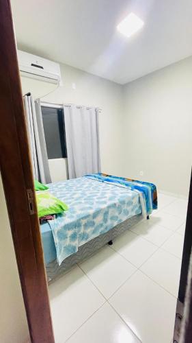 Ένα ή περισσότερα κρεβάτια σε δωμάτιο στο Casa Bastos - Delta do Parnaíba