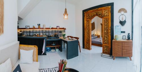 a room with a table and a mirror in a room at NEW Cozy, Smart, Renovated Flat Western Standard in Ubud