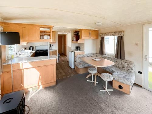 a kitchen and living room of a caravan at The Hunters Haven in Skegness