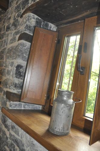 a metal vase sitting on a shelf next to a window at Casa La Ribera in Lon