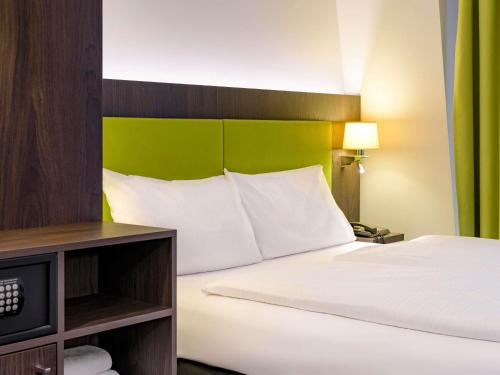 Cama o camas de una habitación en Ibis Styles Trier