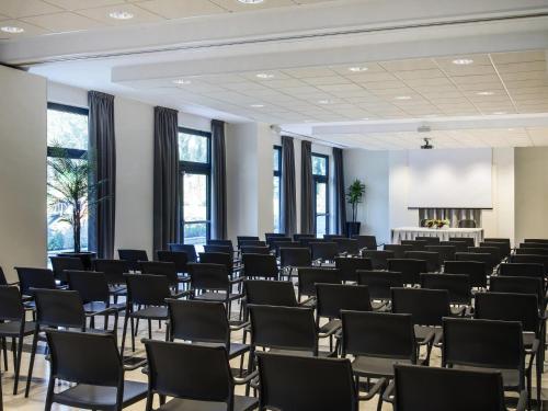 a large room with rows of chairs in it at ibis Styles Milano Est Settala in Settala