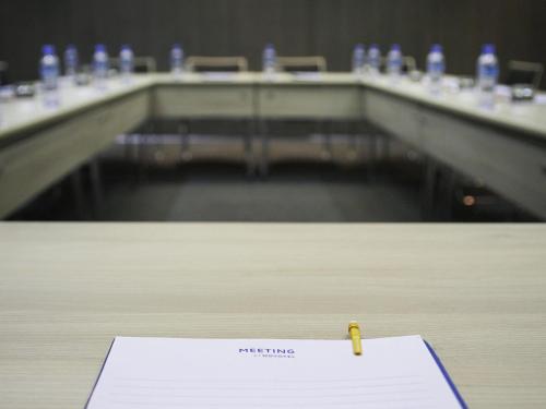 a pen on a paper on a table in a room at Novotel Constantine in Constantine