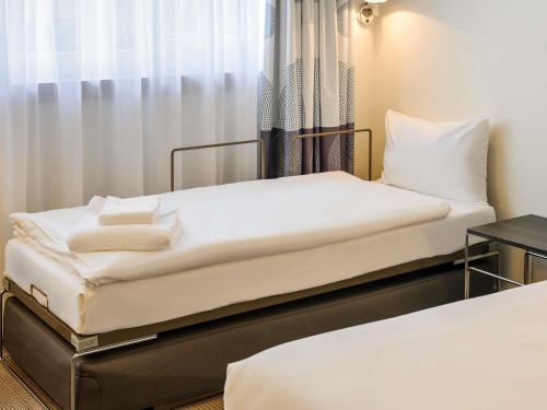 Katil atau katil-katil dalam bilik di Novotel München City Arnulfpark