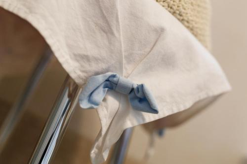 a blue bow on top of a window curtain at Sweet Home in Treviso