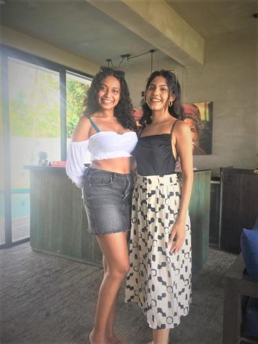 two women standing next to each other in a room at Lazy Koala in Hikkaduwa