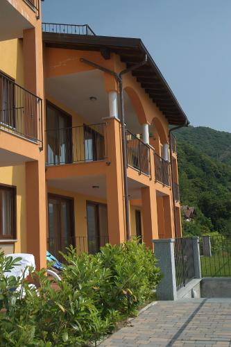 a building with balconies on the side of it at Residence Il Vigneto in Oggebbio