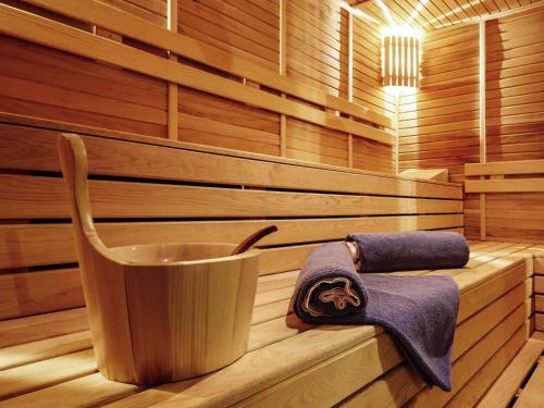 a sauna with two towels and a cup in it at Novotel Konya in Konya