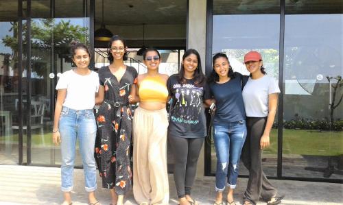a group of women standing in front of a building at Lazy Koala in Hikkaduwa