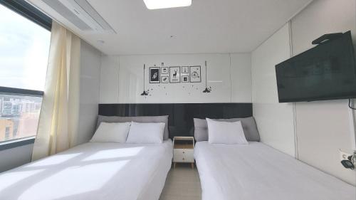 Katil atau katil-katil dalam bilik di Donghae Fine and You Oceancity Hotel by SND