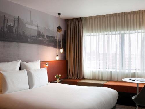 Postel nebo postele na pokoji v ubytování Pullman Liverpool