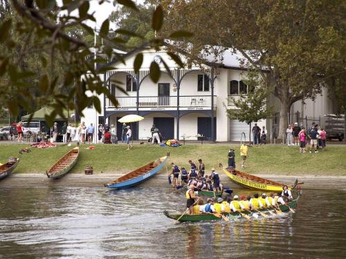 a group of people in boats on a river at Pullman Melbourne On the Park in Melbourne