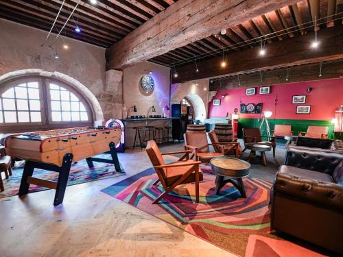 a large room with a pool table and chairs at ibis budget Marseille Vieux Port in Marseille
