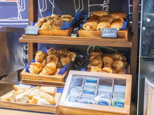 a bakery with different types of breads and pastries at ibis budget London Barking in Barking
