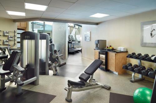 a gym with treadmills and exercise equipment in a room at Marriott at the University of Dayton in Dayton