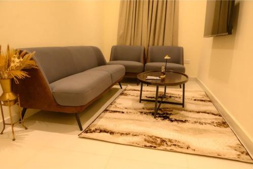 a living room with a couch and a table at Adar Hotel in Lagos