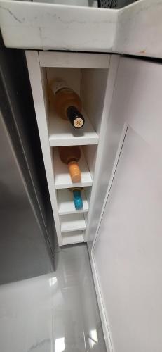 a room with a shelf with a bottle in it at Beachview 1 Bedroom 4 at Sandcastles in Ocho Rios