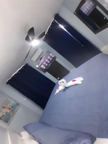 a room with a bed and a desk with a lamp at Beachview 1 Bedroom 4 at Sandcastles in Ocho Rios