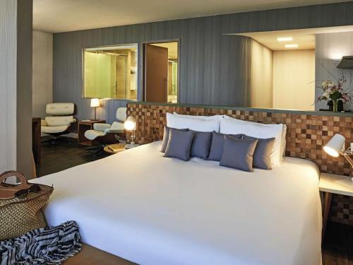 Кровать или кровати в номере Regency Barra Hotel