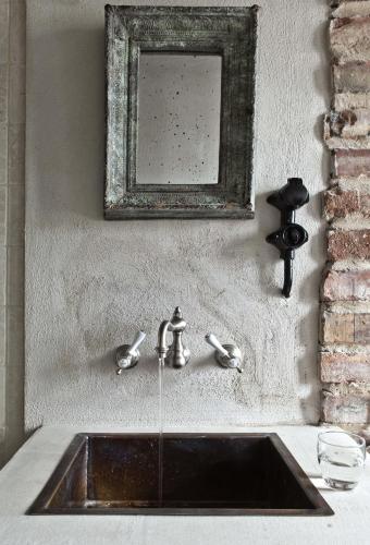 a bathroom sink with a mirror above it at Siggesta Gård in Värmdö