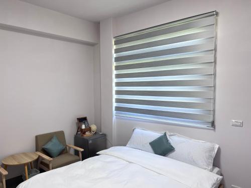 Una cama o camas en una habitación de 逅冶 Houye