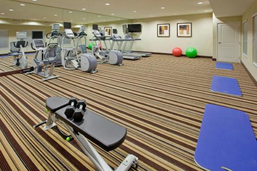 a fitness room with treadmills and exercise machines at Residence Inn Odessa in Odessa