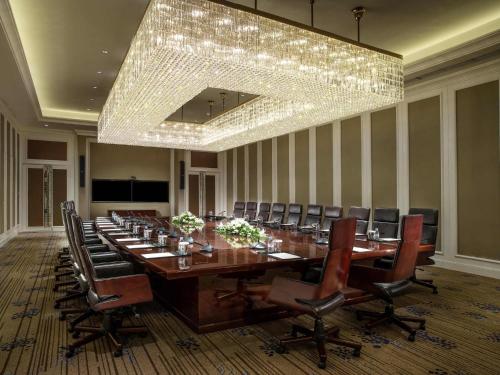 a large conference room with a long table and chairs at The Sebel Xining-Managed By Sofitel in Xining