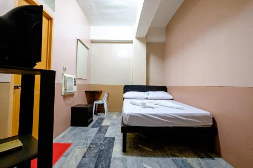 Postel nebo postele na pokoji v ubytování GV Hotel - Ozamiz