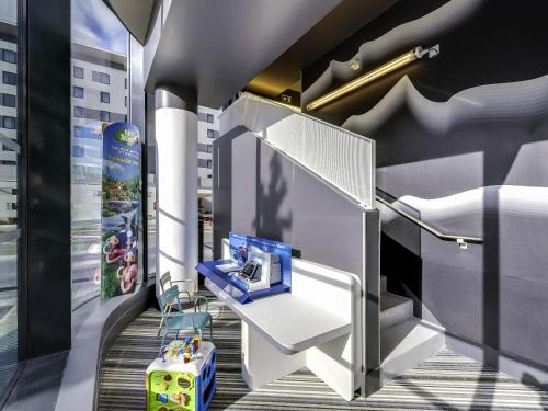 a childrens room with a play equipment in a building at ibis Styles Paris Charles de Gaulle Airport in Roissy-en-France