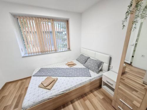 a bedroom with a bed and a window at Ruse Charm Studio 4 in Ruse