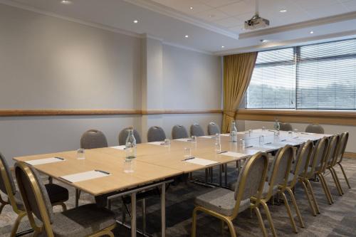 a conference room with a long table and chairs at Delta Hotels by Marriott Edinburgh in Edinburgh