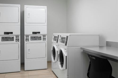 a group of washing machines and a washer and dryer at SpringHill Suites by Marriott Grand Island in Grand Island