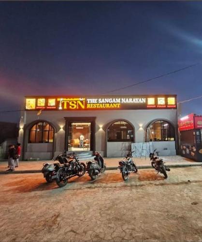 a group of motorcycles parked in front of a store at The Sangam Narayan in Dwarka