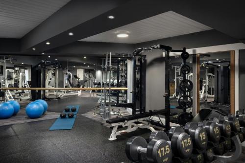 a gym with dumbbells and other equipment at Delta Hotels by Marriott Edinburgh in Edinburgh