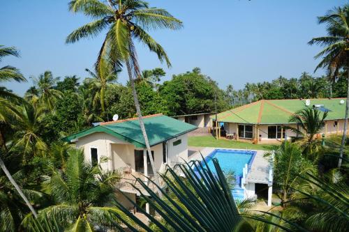 an aerial view of a house and a swimming pool at The New Hilltop Villa in Galle