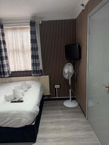 Katil atau katil-katil dalam bilik di Abingdon Lodge Hotel