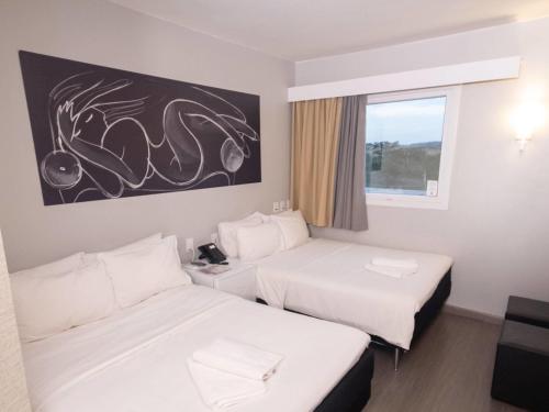Cama o camas de una habitación en ibis Catanduva