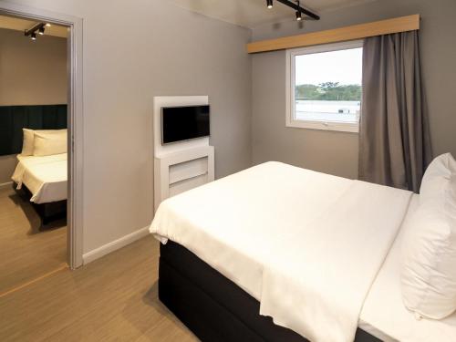 Cama o camas de una habitación en ibis Catanduva