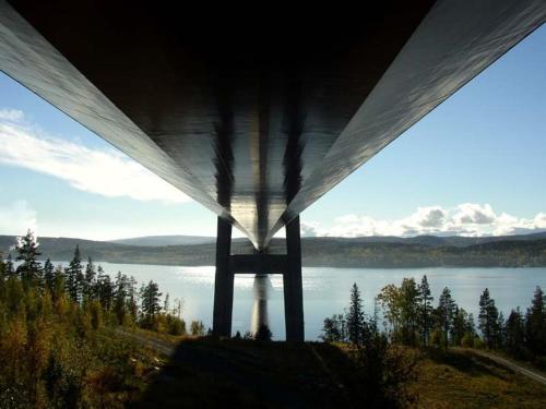 a view of a river from under a bridge at Hotell Höga Kusten in Sandöverken